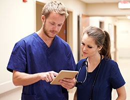 Blog_HealthcareHandoffs_MedProfTabletDocs2talkScrubs_260x200px.jpg