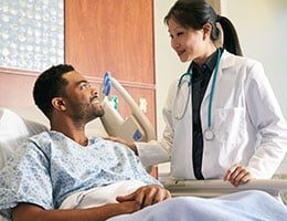 Blog_StrategiesToImproveProviderPatientCommunication_Med Prof ExamHospHandOnShoulder_260x200px.jpg